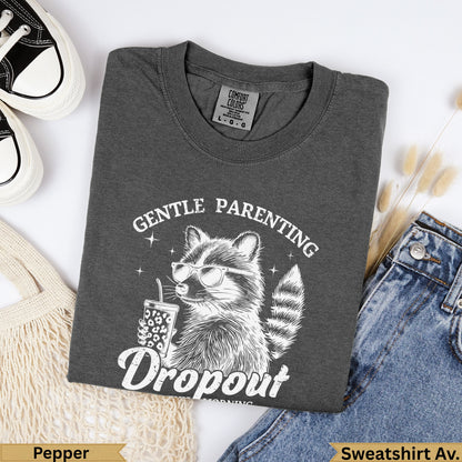 T-shirt with raccoon wearing sunglasses and drinking from a cup, "Gentle Parenting Dropout" text.