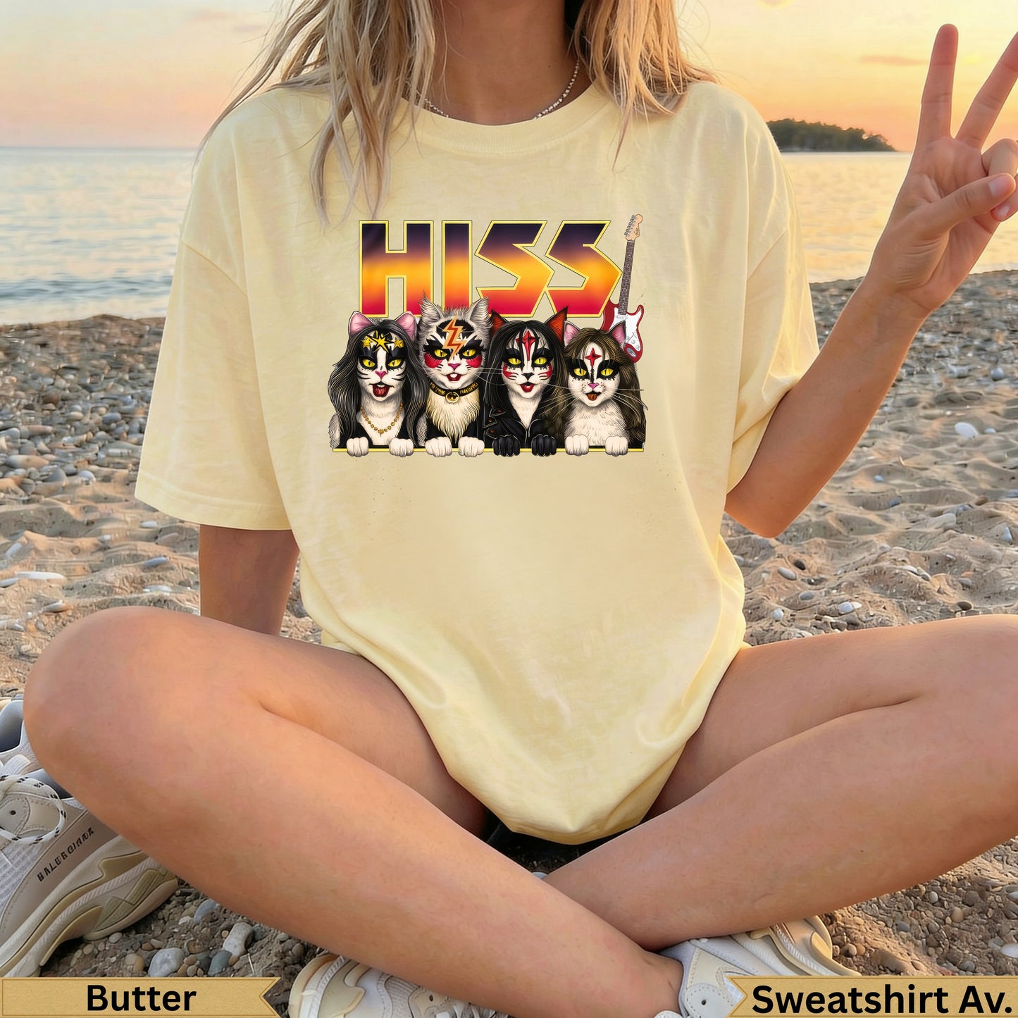 KISS band cats graphic on a pale yellow t-shirt.