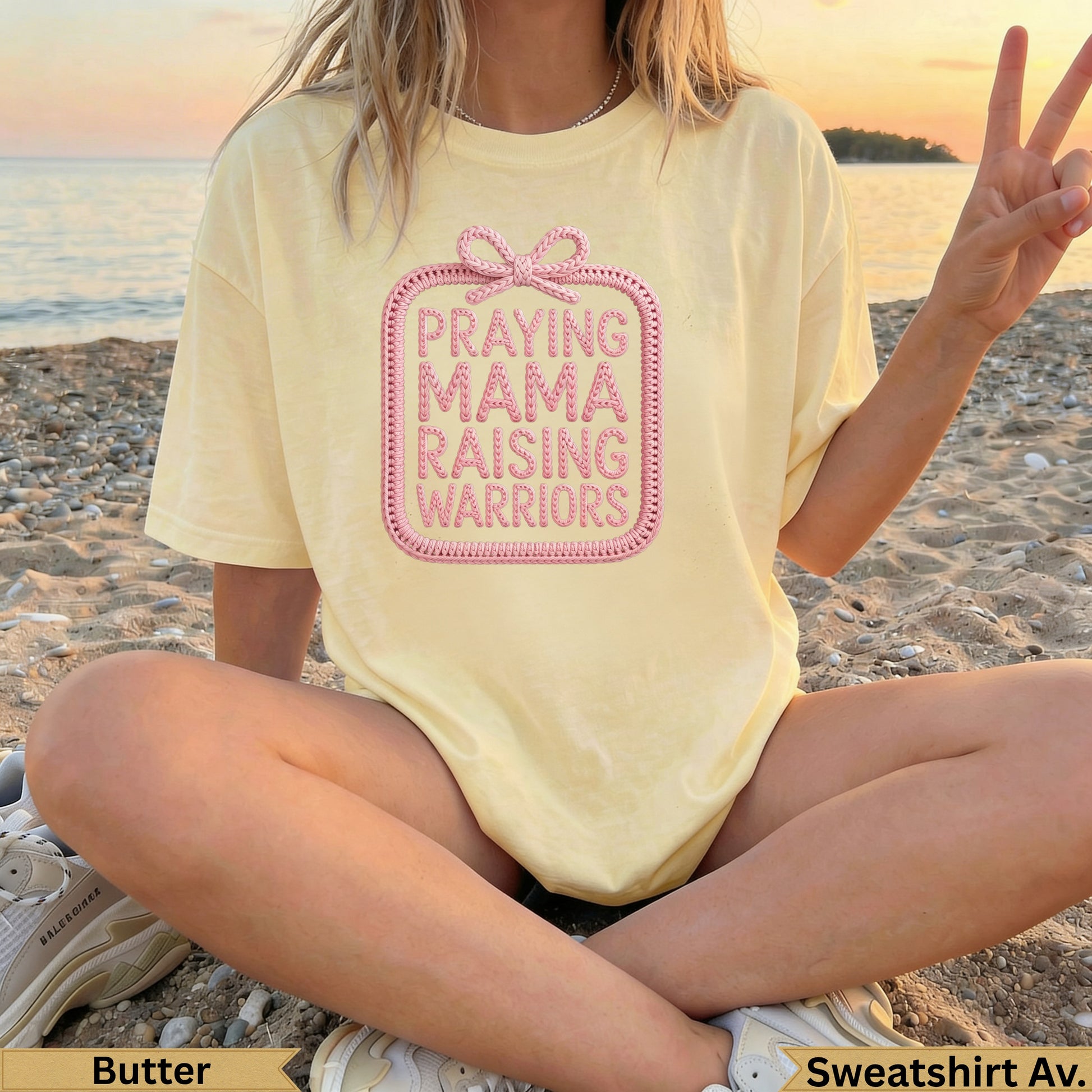 Butter yellow t-shirt with "Praying Mama Warriors" text inside a pink bow design.