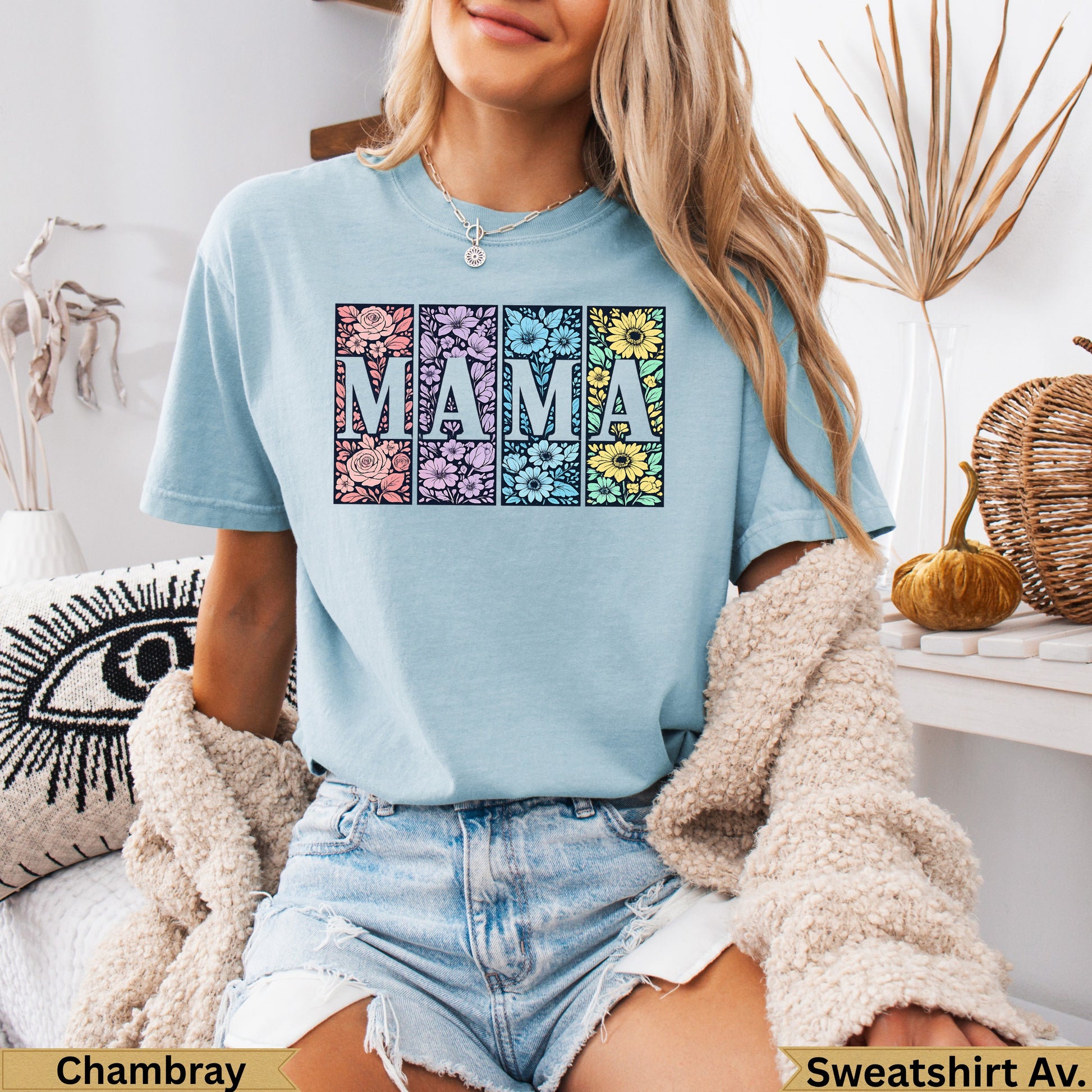 Light blue t-shirt with "MAMA" spelled out in floral squares.