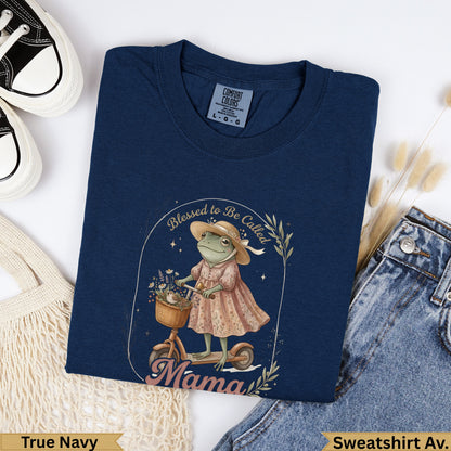 Navy sweatshirt with frog wearing hat and dress, riding bike, text "Blessed to Be Called Mama".