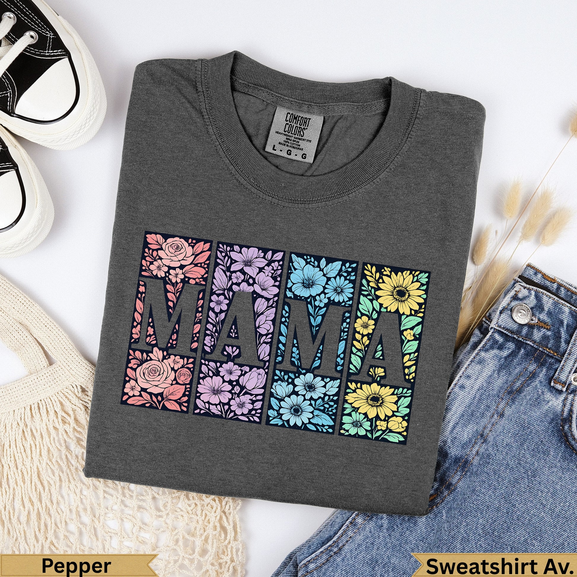 Dark gray Comfort Colors sweatshirt with "MAMA" in floral block letters.