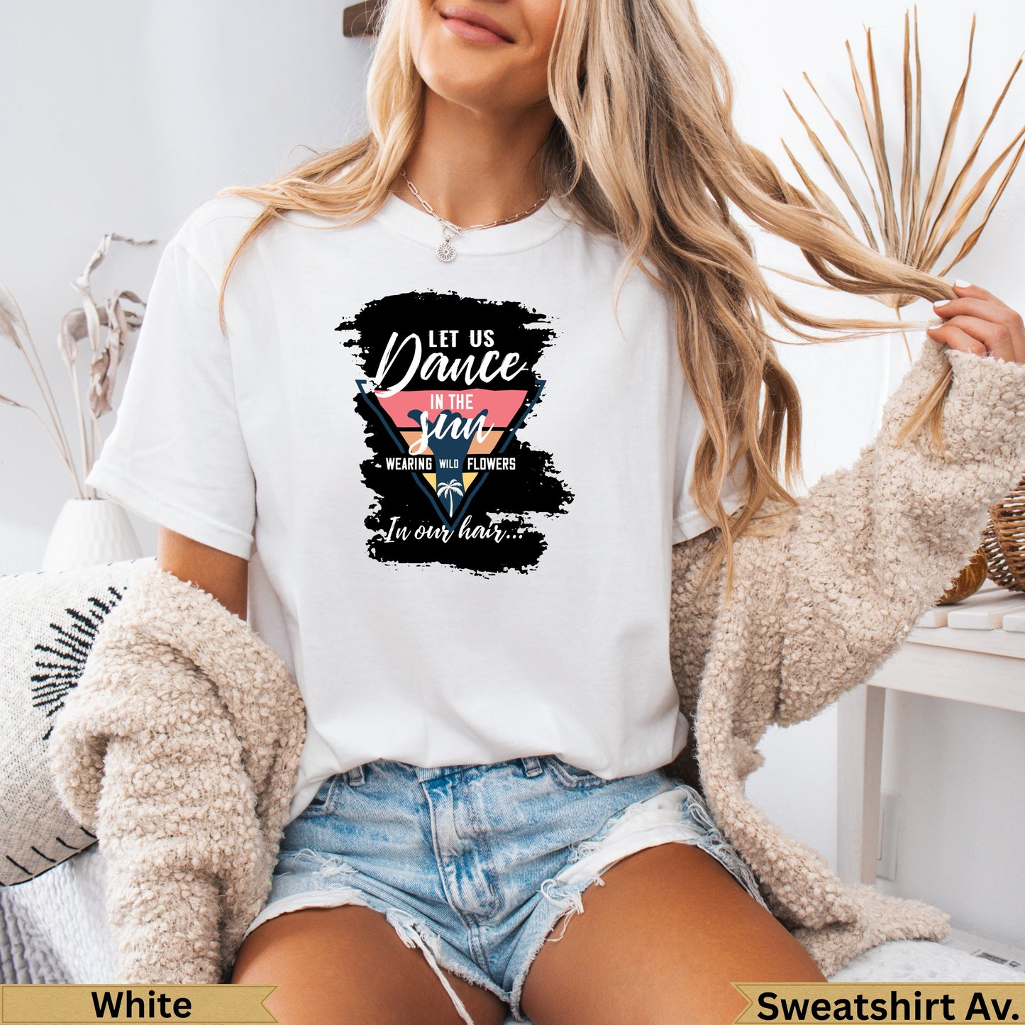 White t-shirt with "Let Us Dance in the Sun" graphic and floral details.