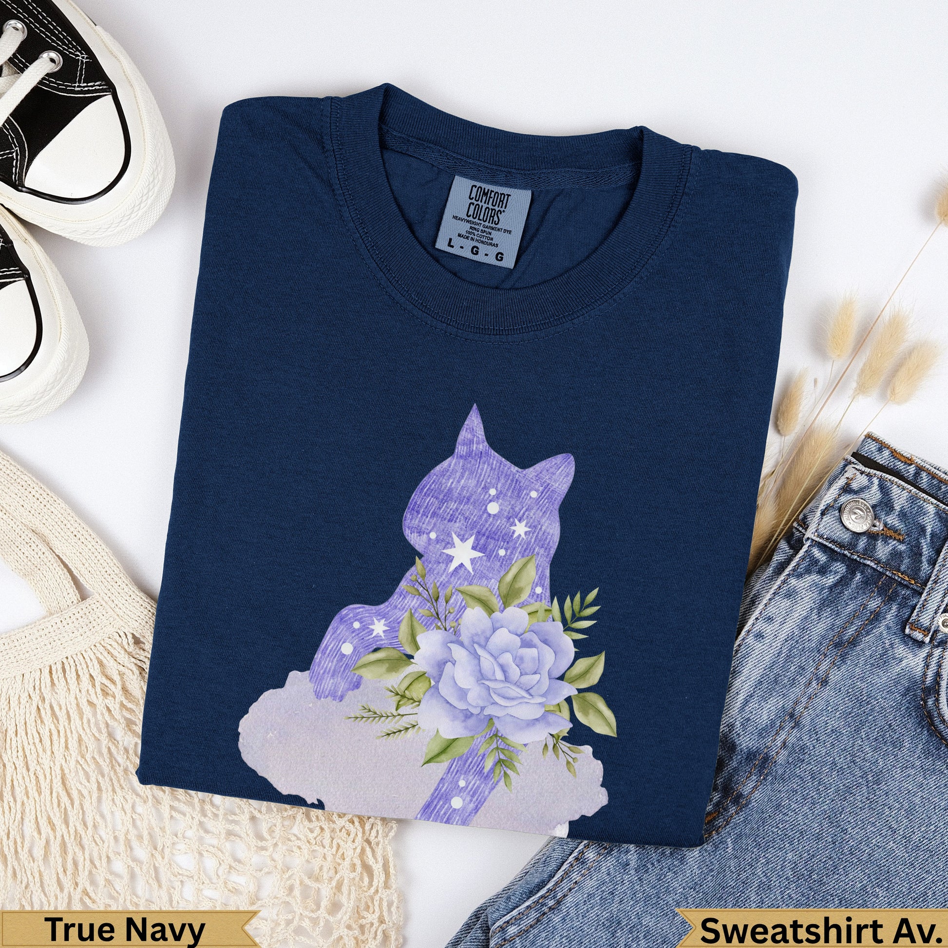 Navy blue sweatshirt with purple floral cat silhouette graphic and "True Navy" label.