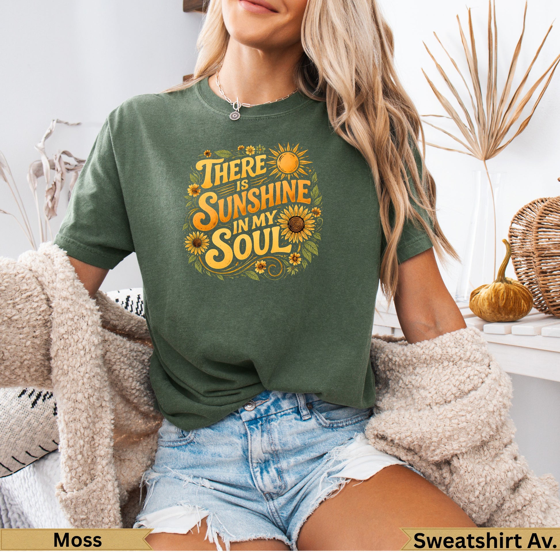 Olive green graphic t-shirt with "There is sunshine in my soul" text and sunflower design.