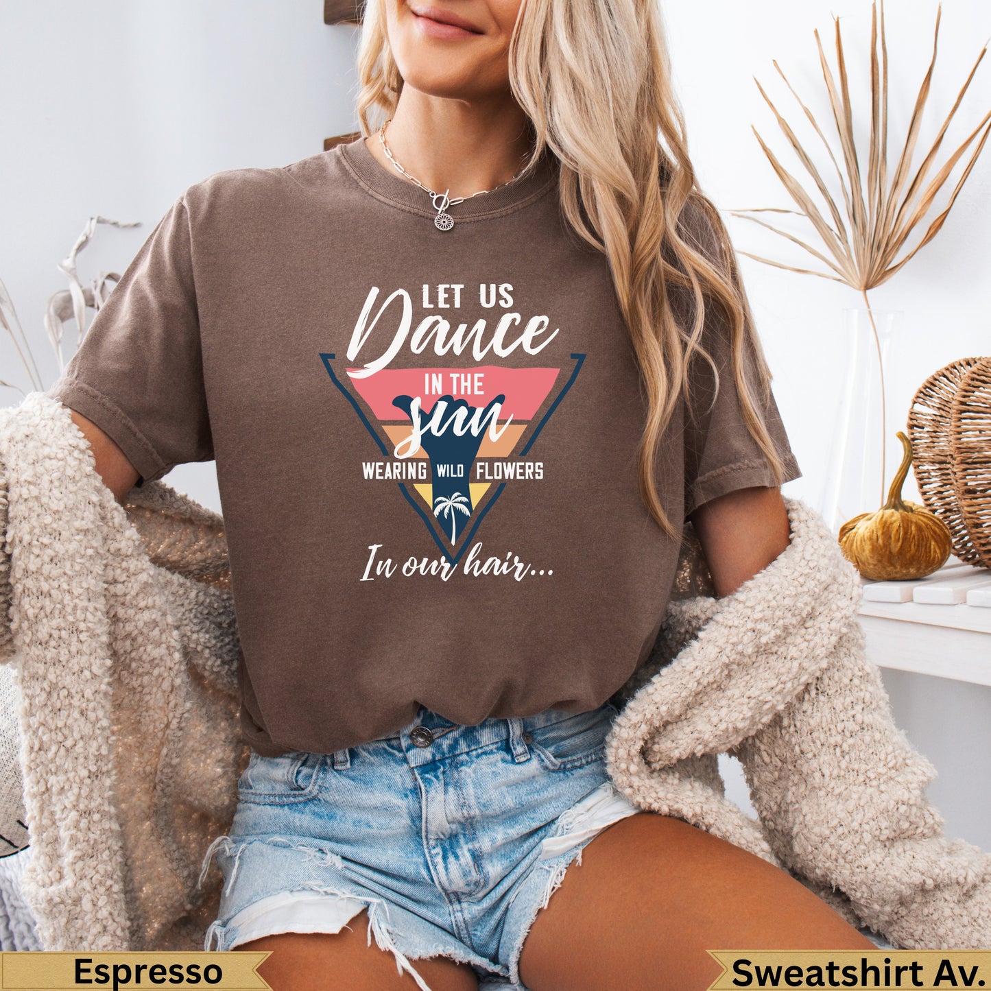 Brown t-shirt with "Dance in the sun wearing wild flowers" text design.