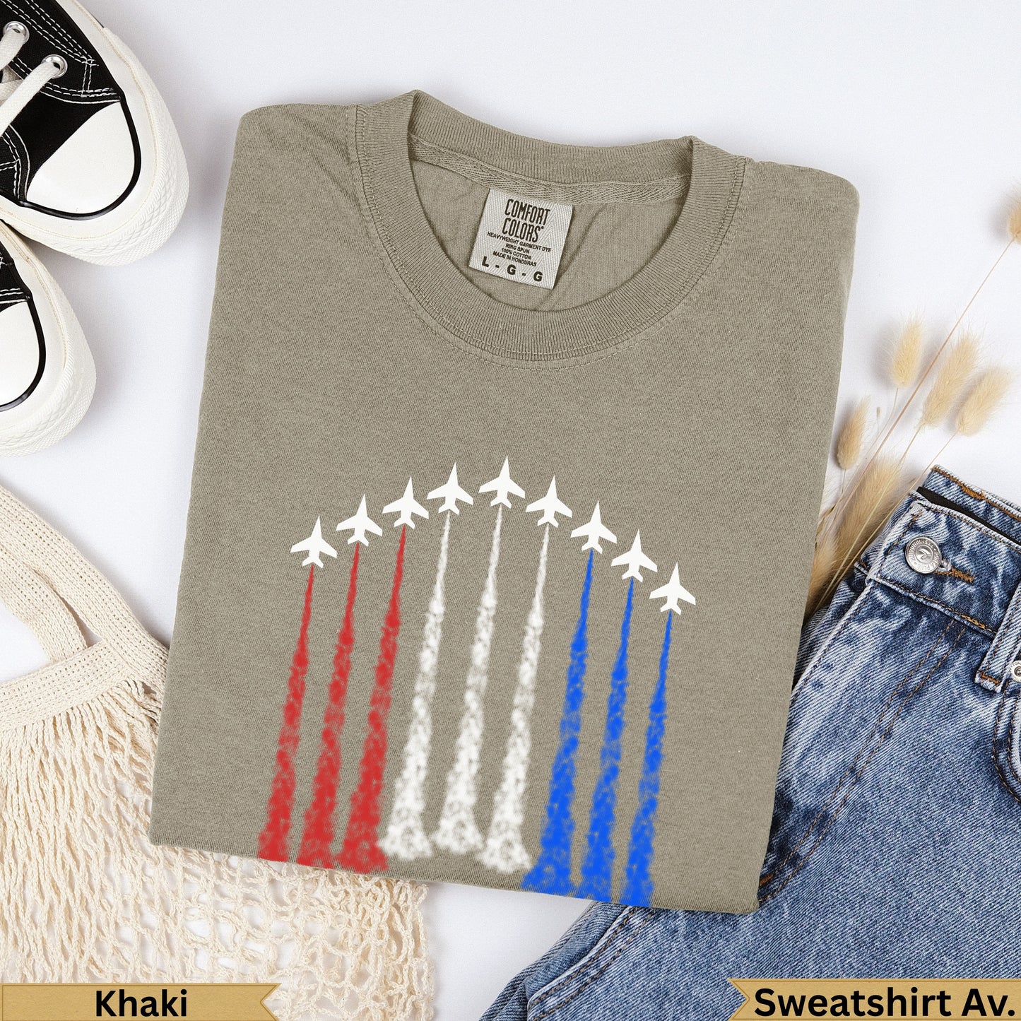 Khaki Comfort Colors t-shirt with red, white, and blue jet contrails.