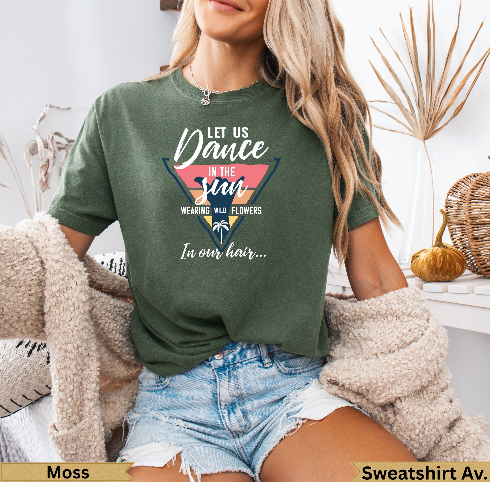 Green crewneck sweatshirt with "Dance in the Sun" graphic.