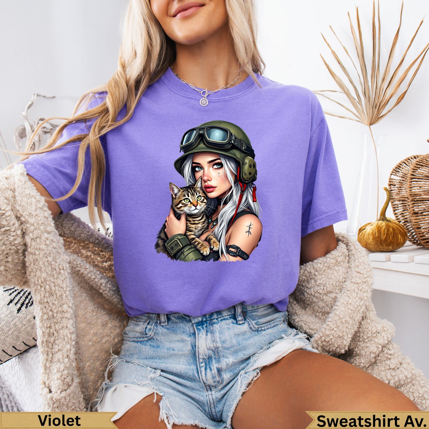 Purple t-shirt with tattooed woman in helmet holding cat, with "Violet" and "Sweatshirt Av." text.