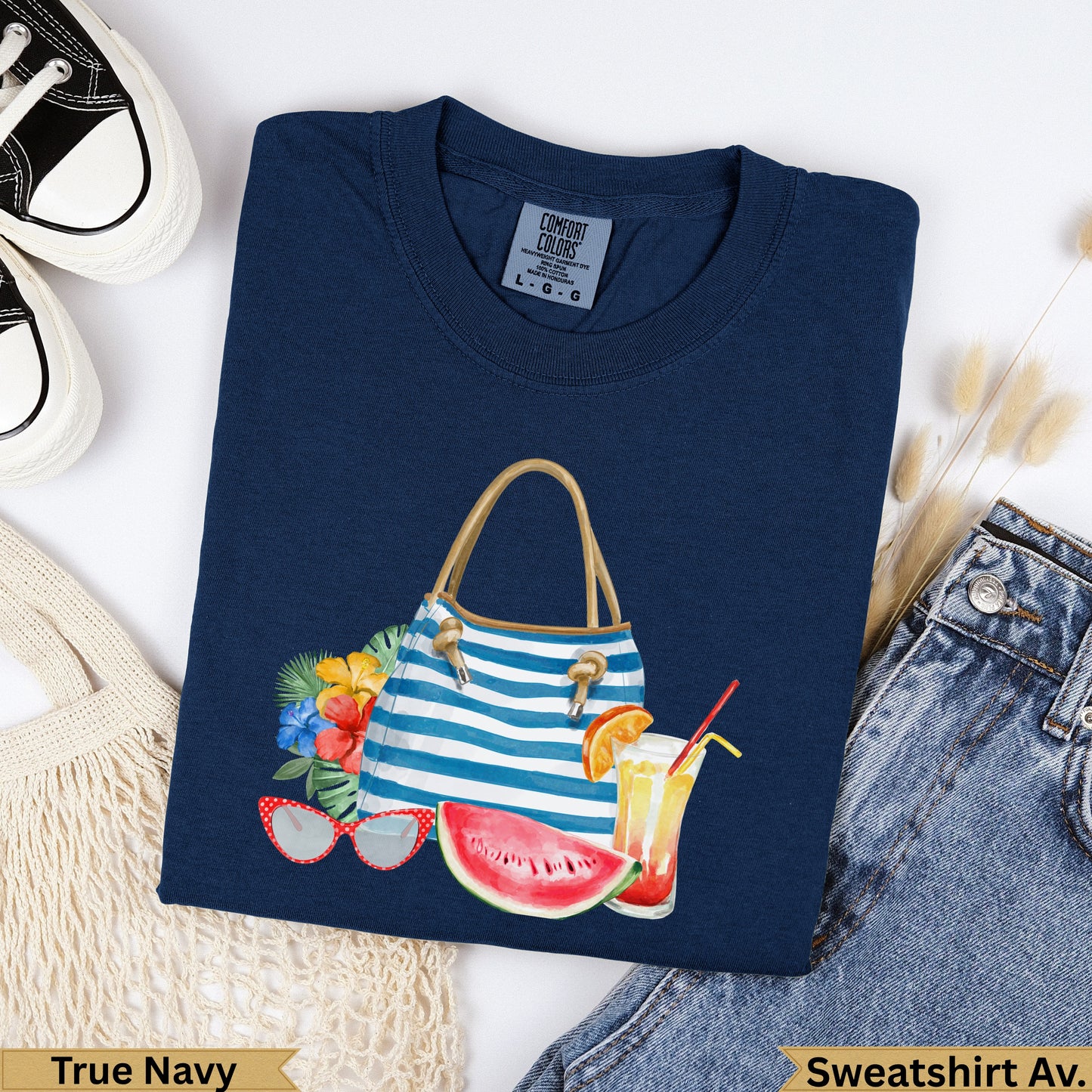 Navy blue graphic t-shirt with beach bag, watermelon, and sunglasses graphic.