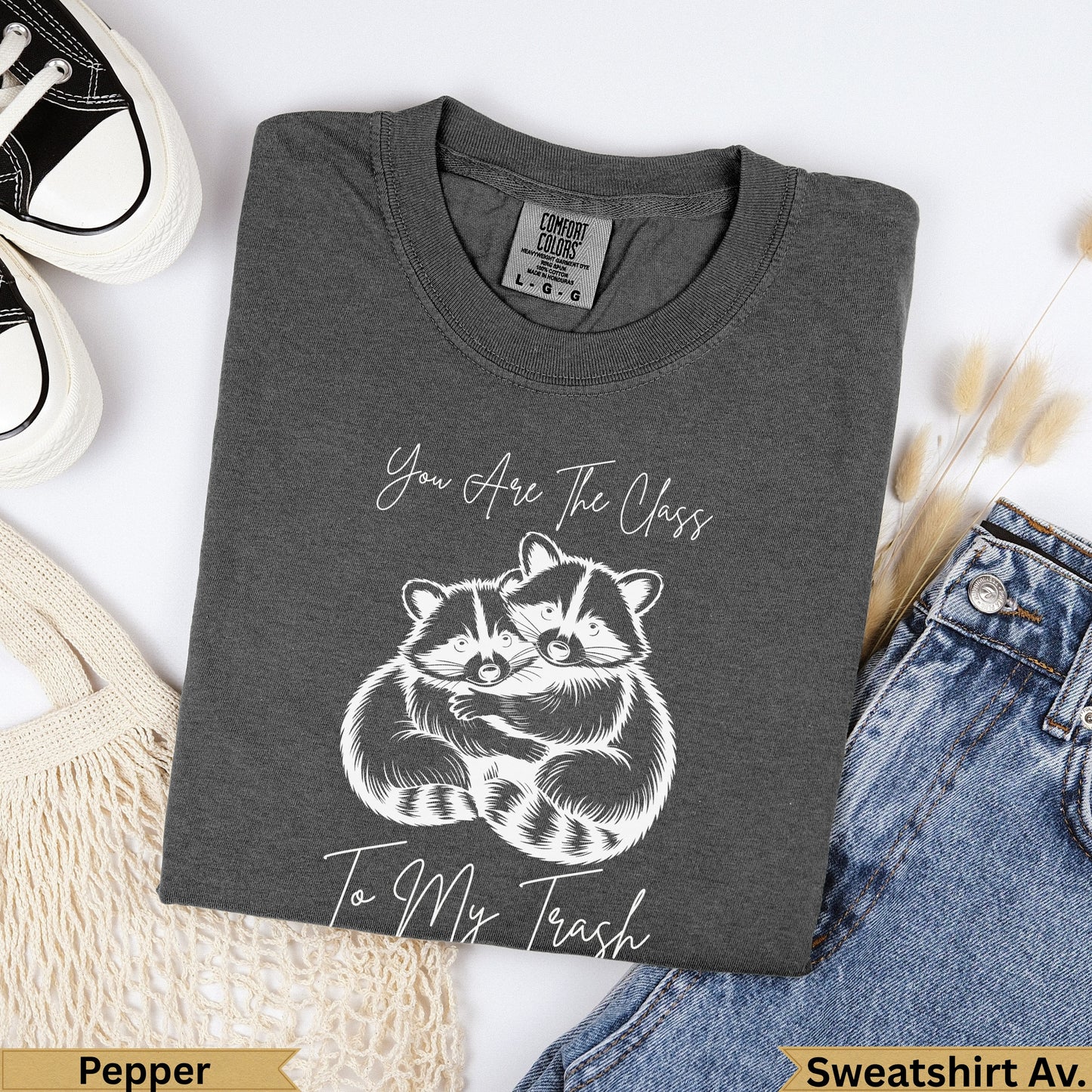 Dark grey t-shirt with two raccoons hugging and text "You Are The Class To My Trash".