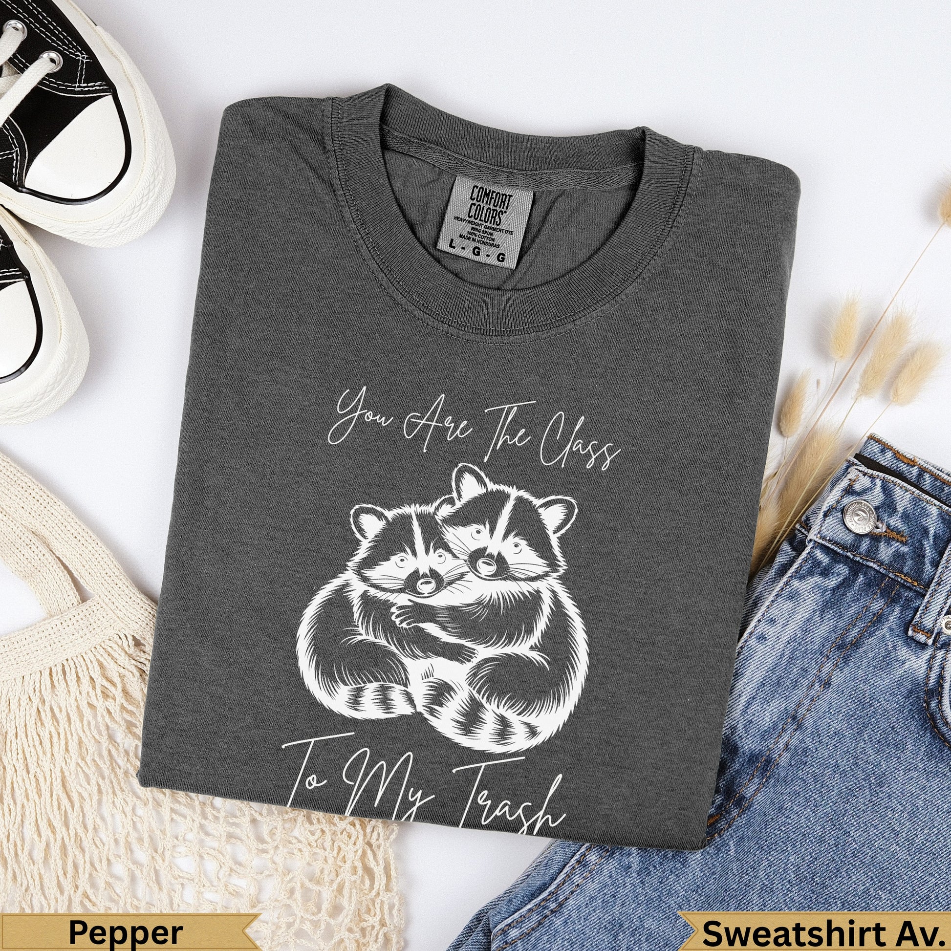 Dark grey t-shirt with two raccoons hugging and text "You Are The Class To My Trash".