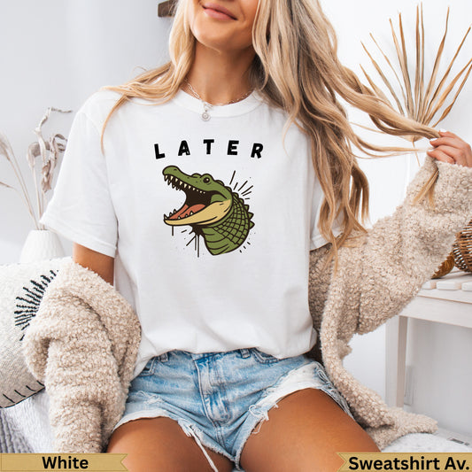 White t-shirt with "LATER" text and a cartoon alligator graphic.