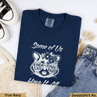 Navy sweatshirt with graphic of raccoon wearing sunglasses and text "Some of Us are KINDA CLASSY KINDA TRASHY".