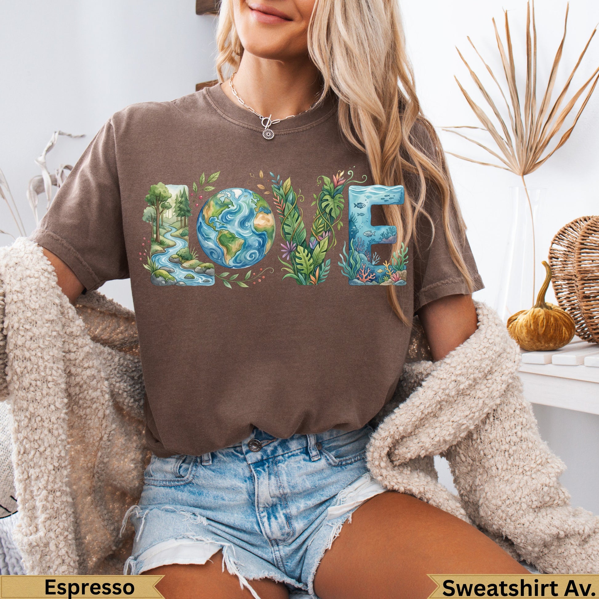 Brown t-shirt with "LOVE" text featuring nature-themed illustrations.