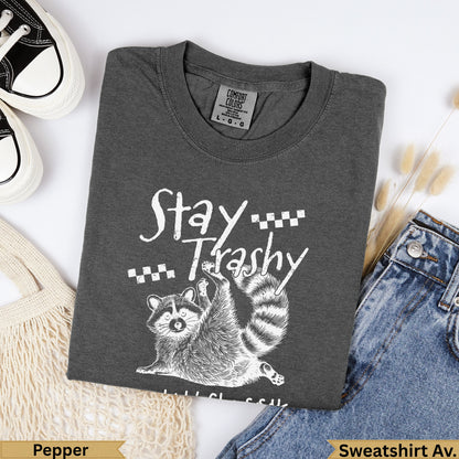 Dark grey Comfort Colors sweatshirt with "Stay Trashy" raccoon graphic.