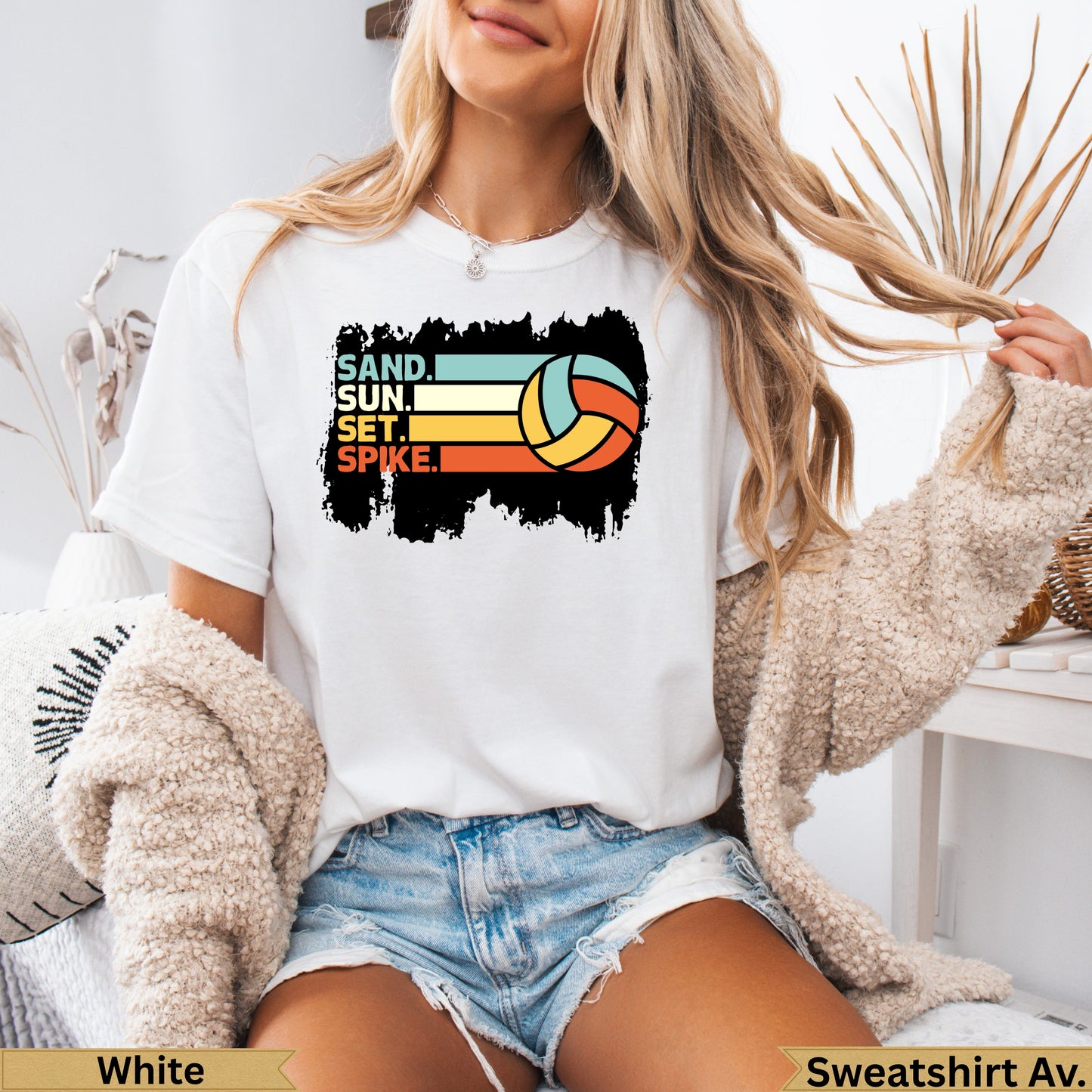 White t-shirt with "SAND. SUN. SET. SPIKE." and volleyball graphic.