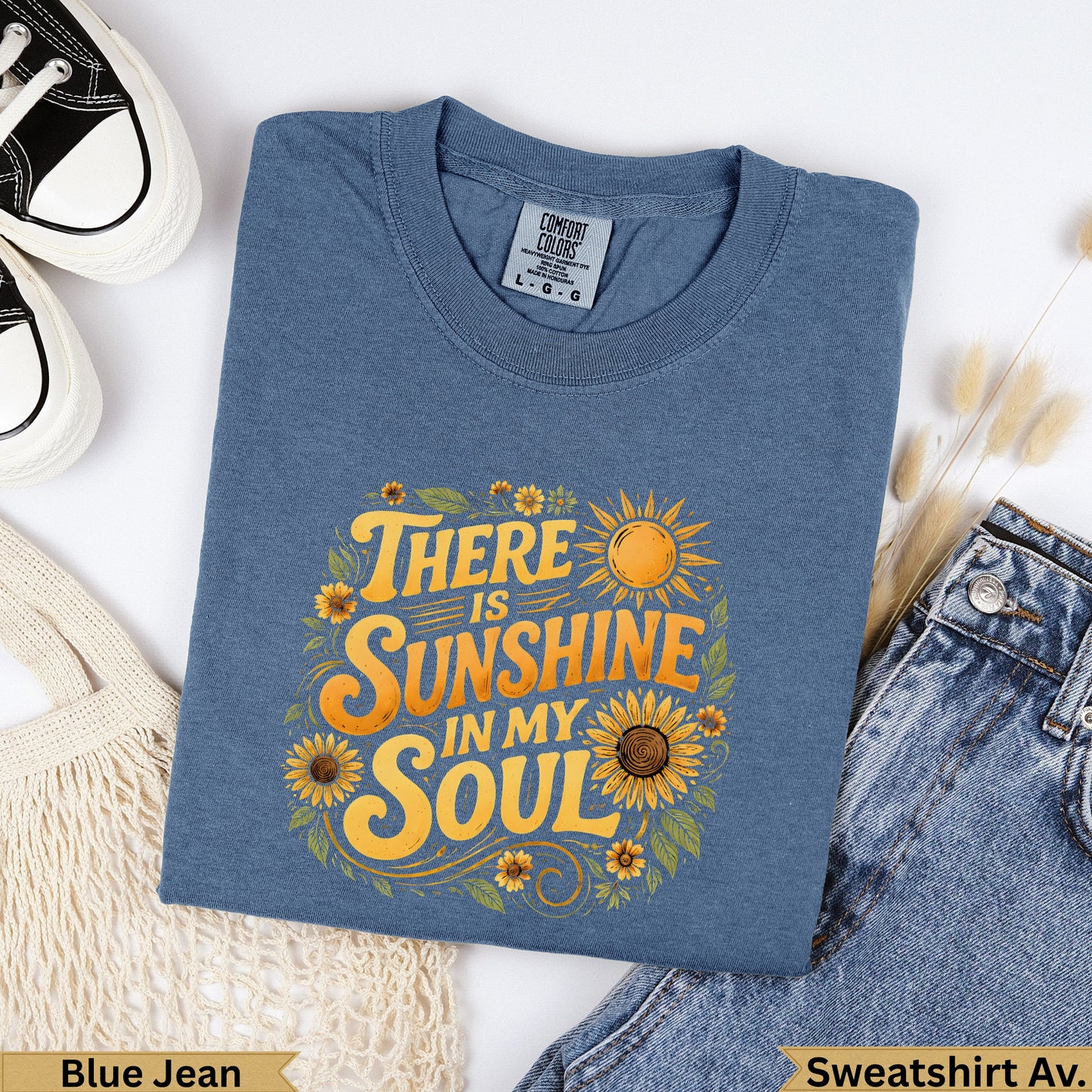 Blue Jean sweatshirt with "There Is Sunshine In My Soul" floral graphic.