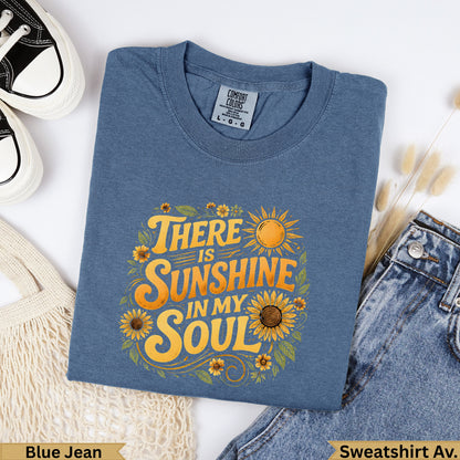 Blue Jean sweatshirt with "There Is Sunshine In My Soul" floral graphic.