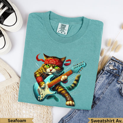 Teal t-shirt with cat playing electric guitar, text "Seafoam" and "Sweatshirt Av.".