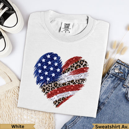 White t-shirt with glittery distressed American flag heart graphic.