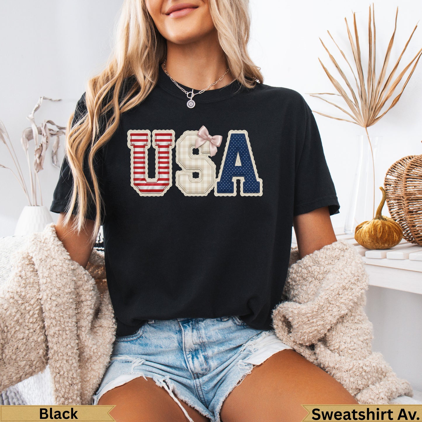Black t-shirt with "USA" in red, white, and blue plaid and navy letters.