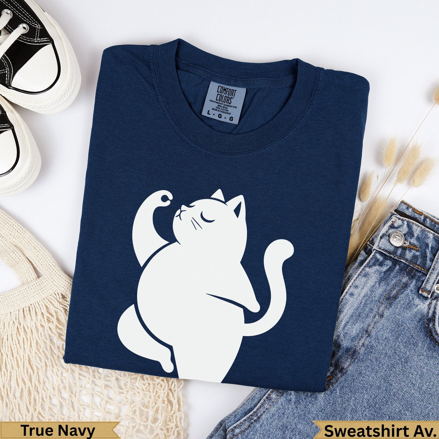 Navy Comfort Colors sweatshirt with white cat graphic and size tag.