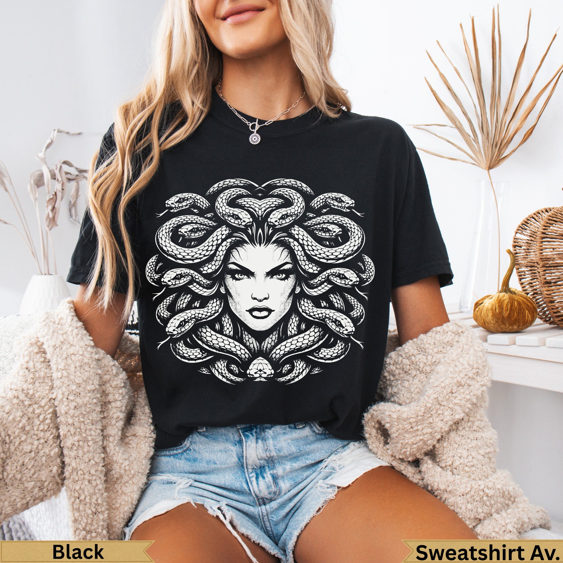 Black t-shirt with Medusa graphic and snake hair.