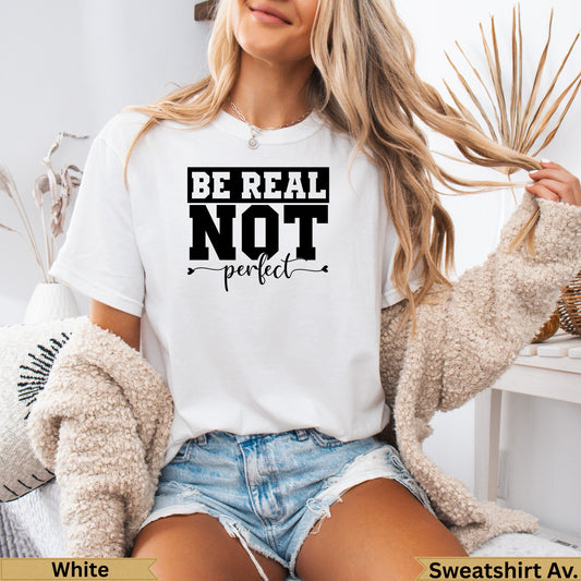 White t-shirt with "Be Real Not Perfect" text on the front.