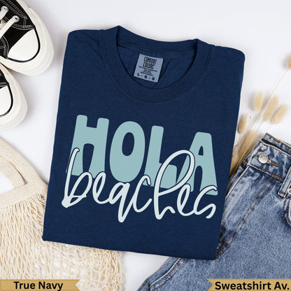 Navy blue t-shirt with "Hola beaches" graphic.