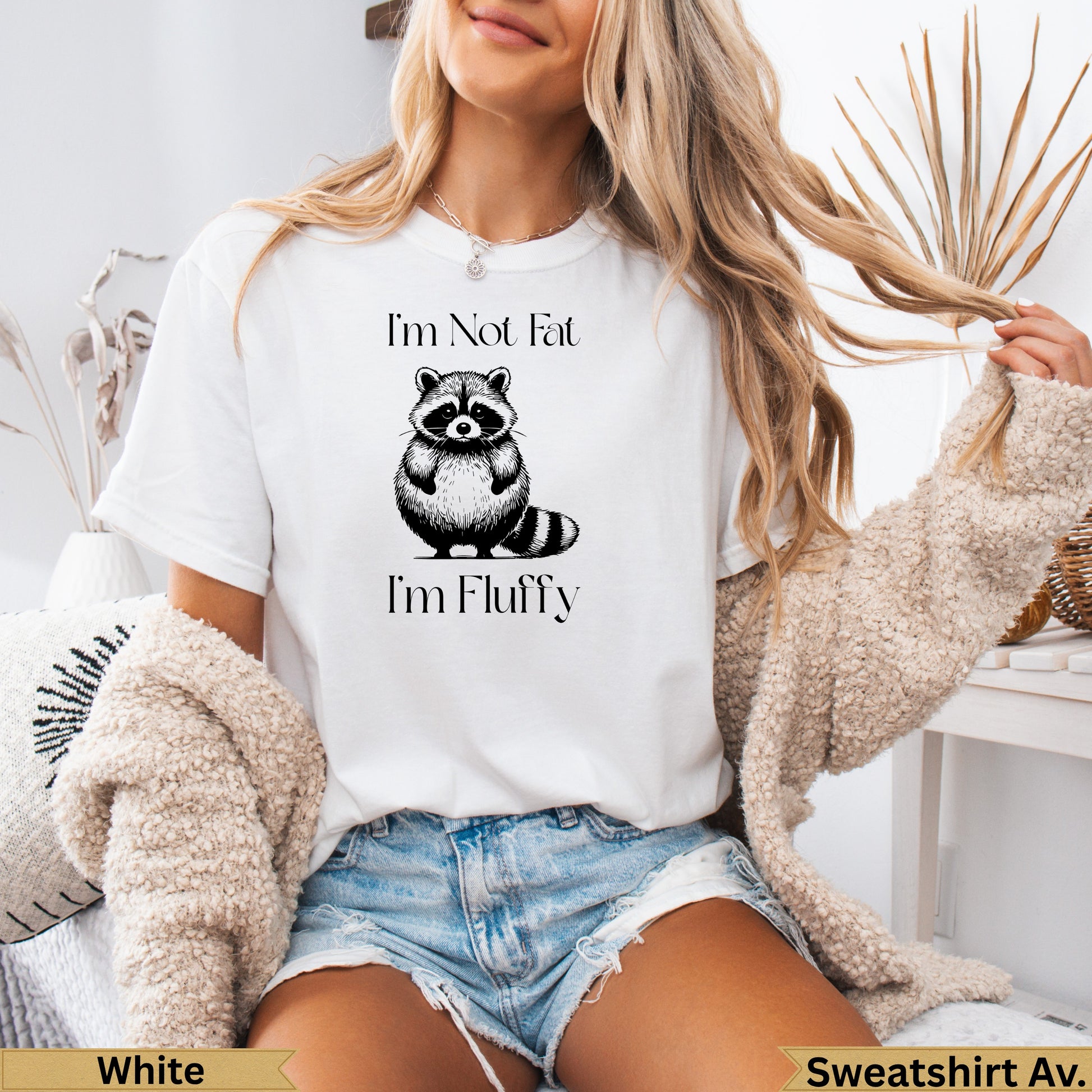 White graphic t-shirt with raccoon and text "I'm Not Fat I'm Fluffy".