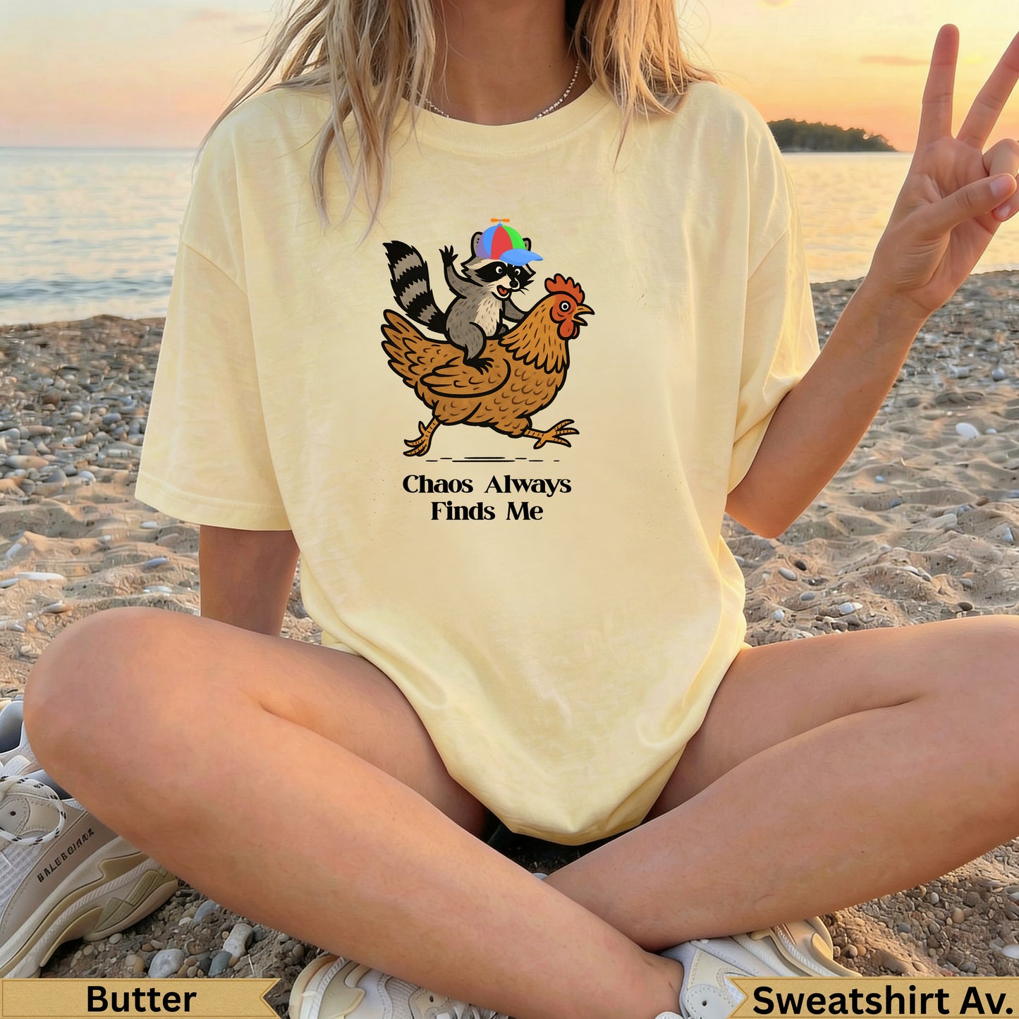 Raccoon wearing a hat rides a chicken with text "Chaos Always Finds Me".