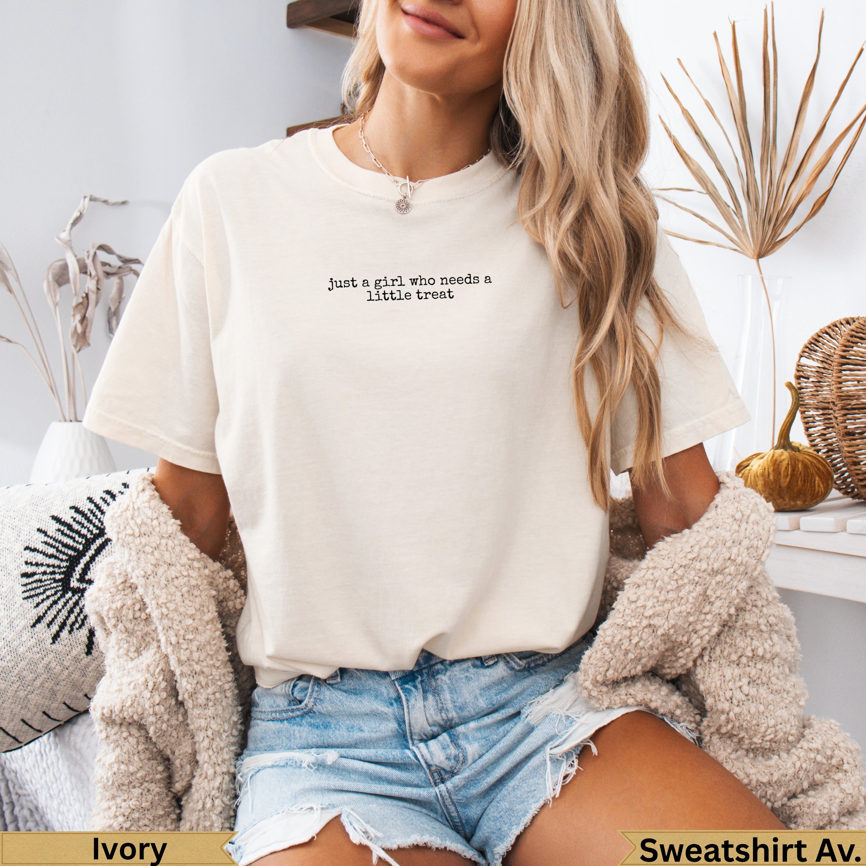 Cream t-shirt with "just a girl who needs a little treat" text.