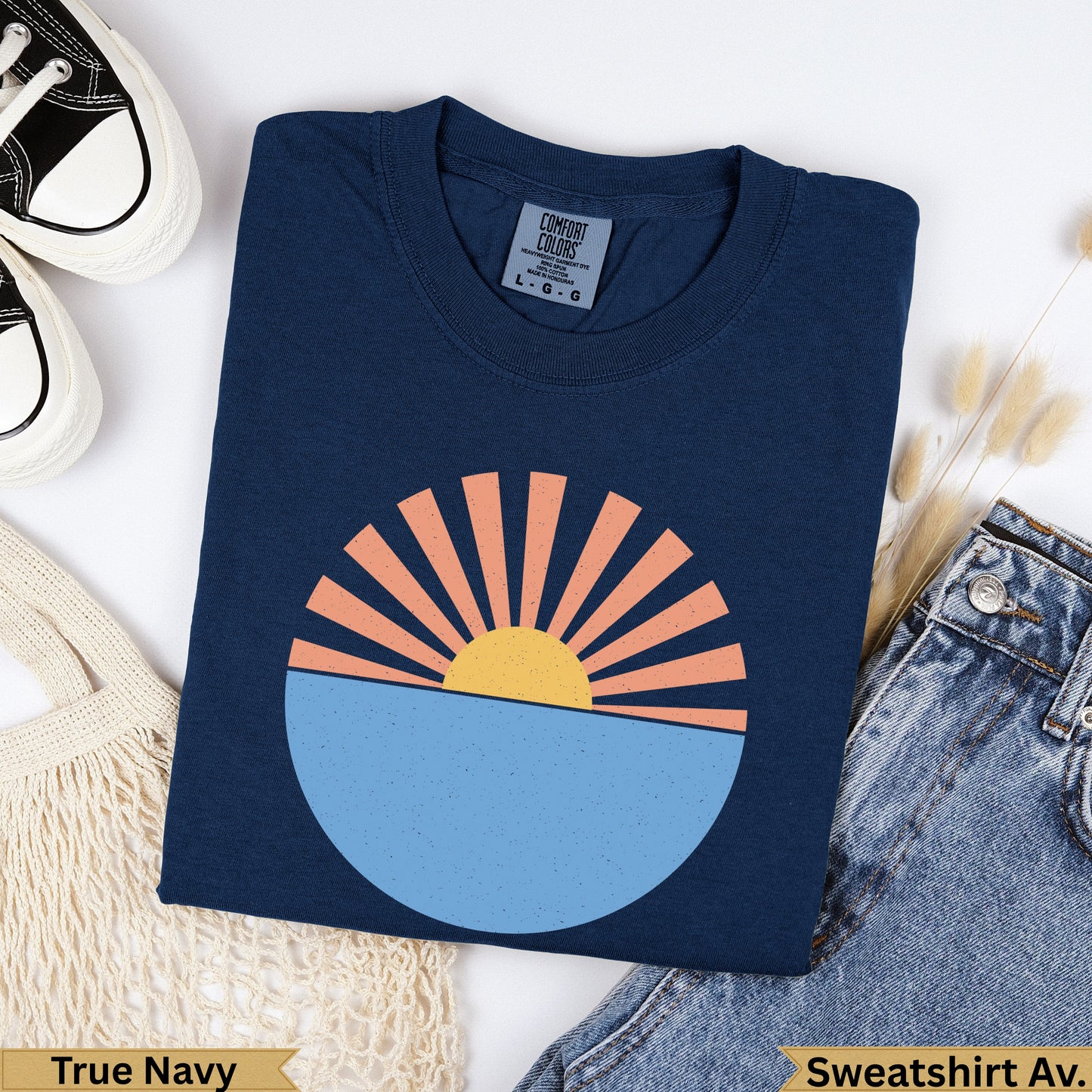 Navy blue t-shirt with a circular sun over water graphic.