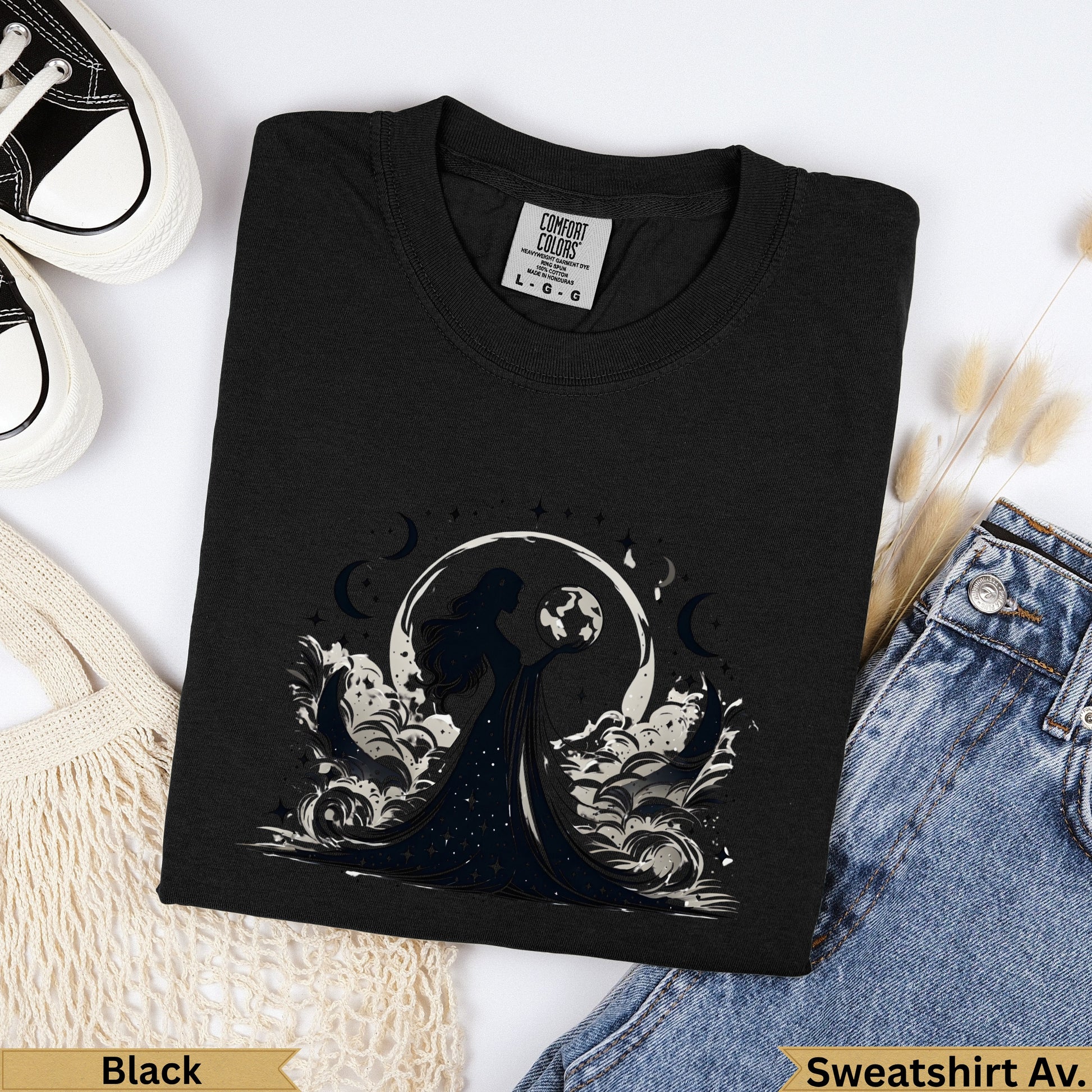 Black long-sleeved t-shirt with celestial woman graphic and moon graphic.