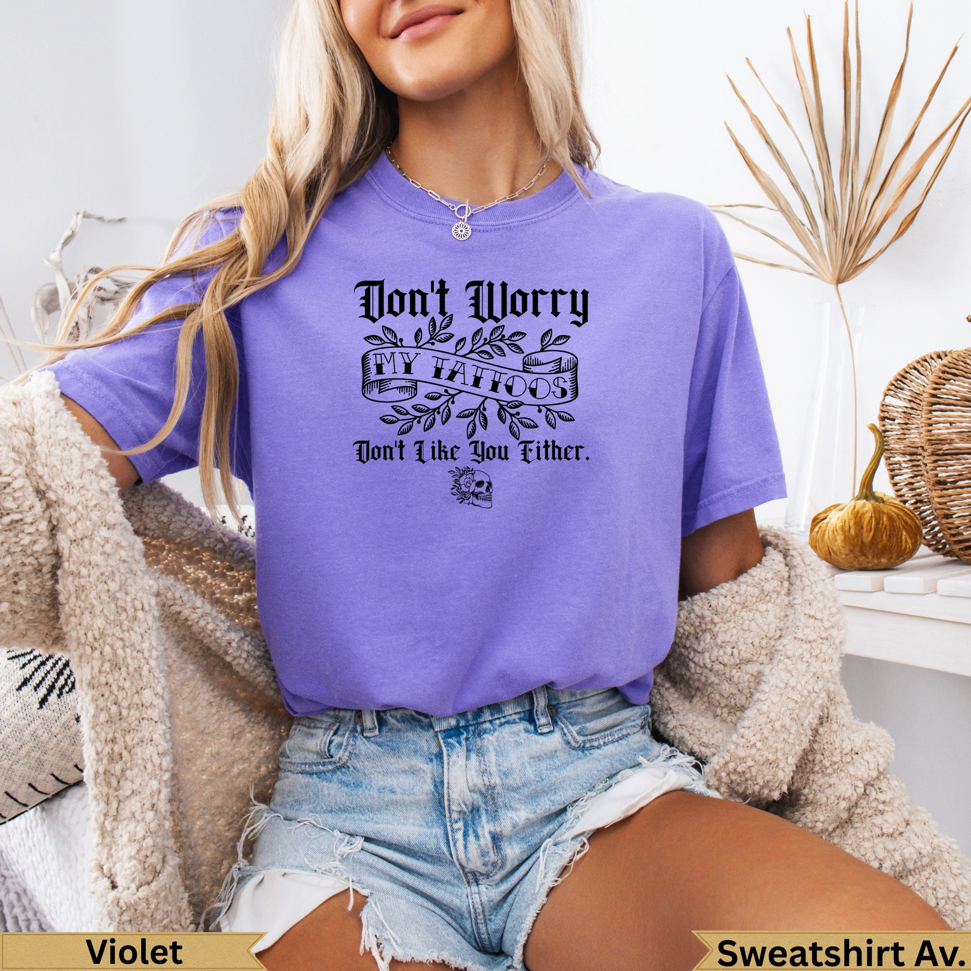 Purple t-shirt with "Don't Worry, Don't Like You Either" text and skull graphic.